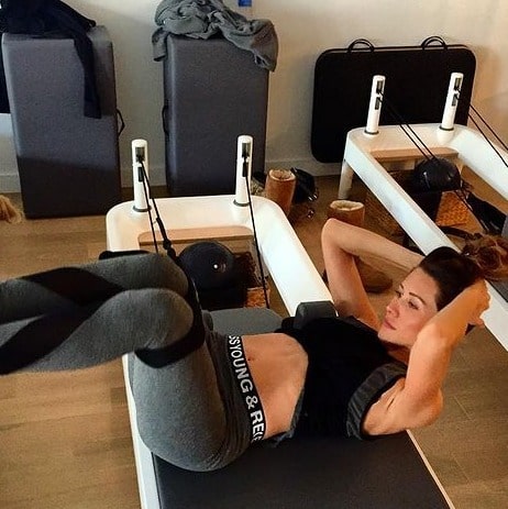 Picture of  Erin Coscarelli doing yoga in yoga suit